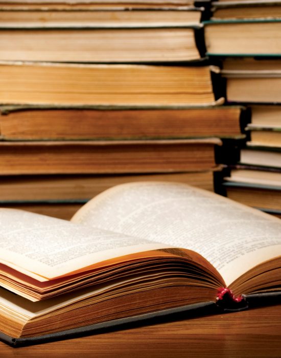 A stack of old books on the table.